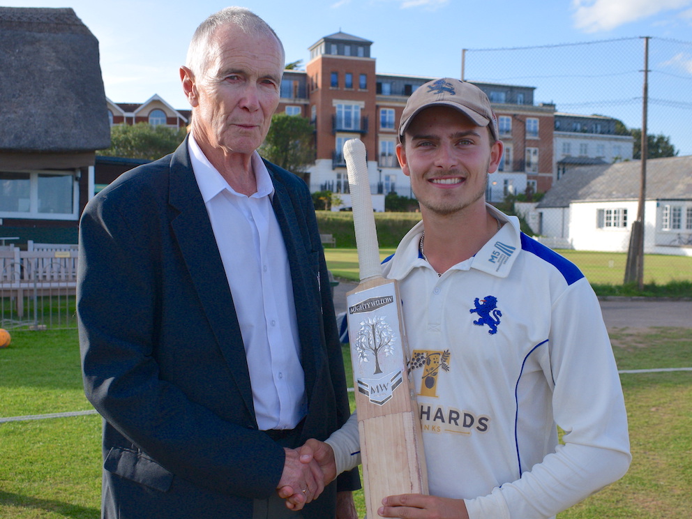 Devon batsman Ben Beaumont receiving the young player of the year award, a bat donated by England cricketer Moeen Ali, from Devon CCC president Jack Davey<br>credit: Conrad Sutcliffe - no re-use without copyright owner's consent