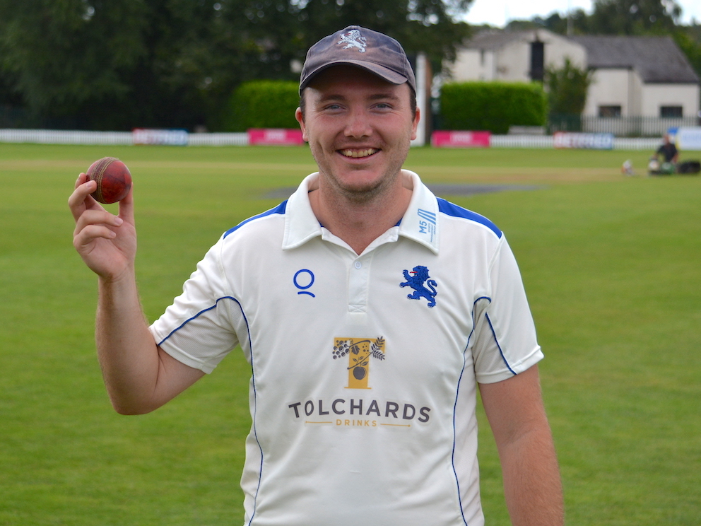 Devon's Matt Skeemer shows off the match ball he took six Cheshire wickets with<br>credit: Conrad Sutcliffe - no re-use without copyright owner's consent