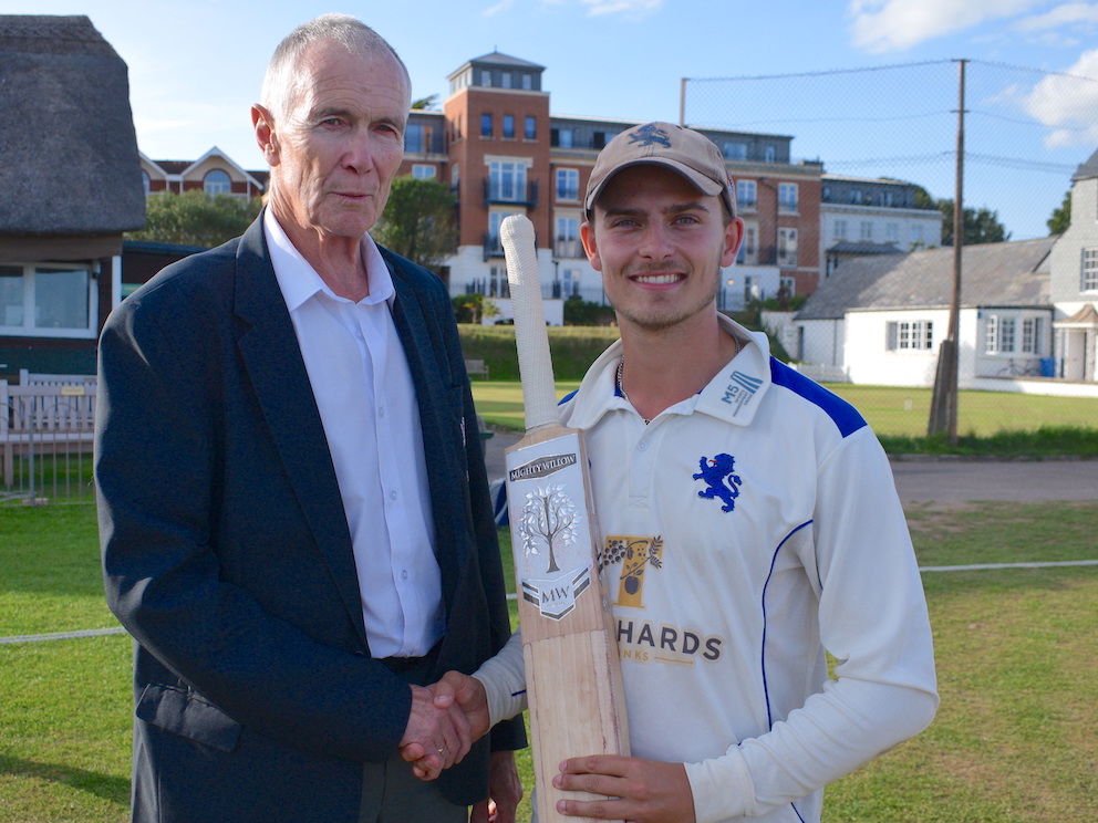 Ben Beaumont receiving Devon's young player of the year award, a bat donated by England cricketer Moeen Ali, from county president Jack Davey<br>credit: Conrad Sutcliffe - no re-use without copyright owner's consent