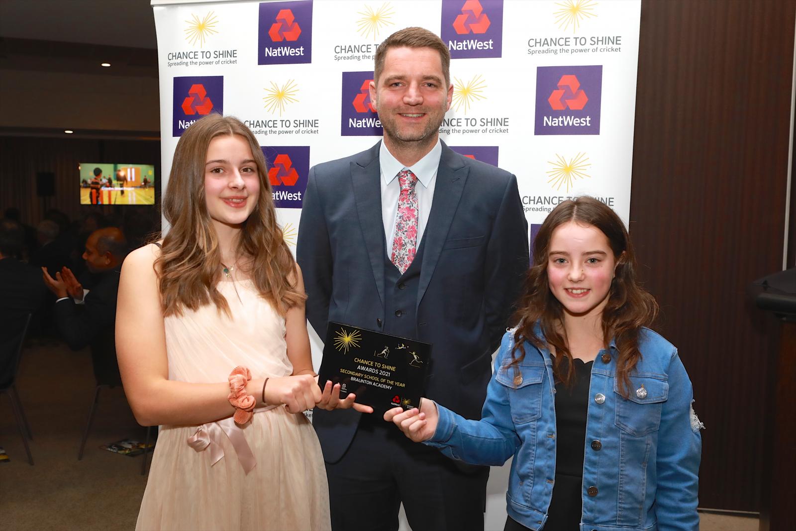 Bella, Mr Frickleton and Rosie with their award