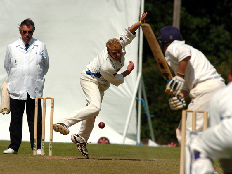 Peter Kingston Davey watches as Ian Bishop bowls for Devon against Cheshire at Bovey Tracey in 2005