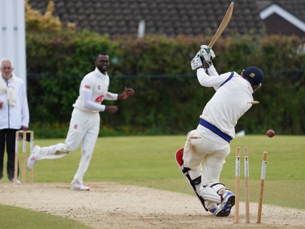Ashburton's Arun Karthick on his way to a three-wicket haul against Babbacombe<br>credit: Julian Preston