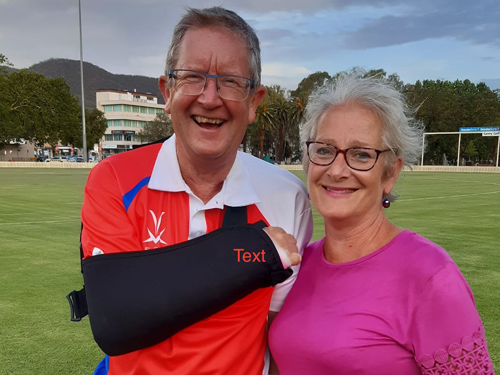 Still smiling! Nigel Ashplant's wife Bridge consoles him after he broke his right arm playing for England Over-60s in Australia