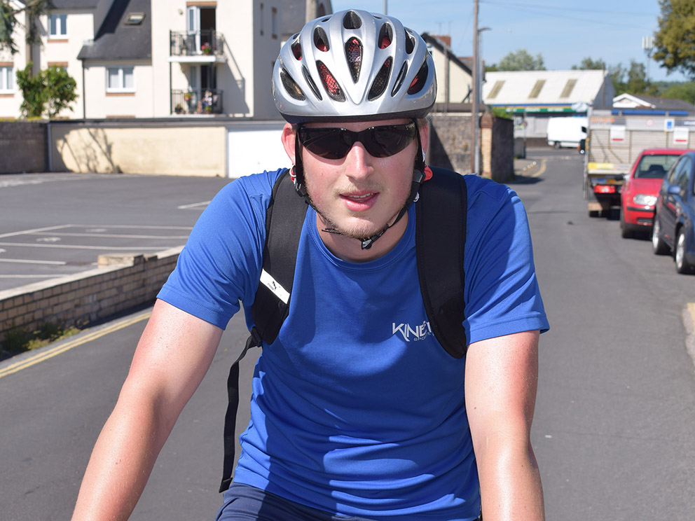 Neal Osborn takes a brief breather in Newton Abbot during his charity bike ride<br>credit: Conrad Sutcliffe
