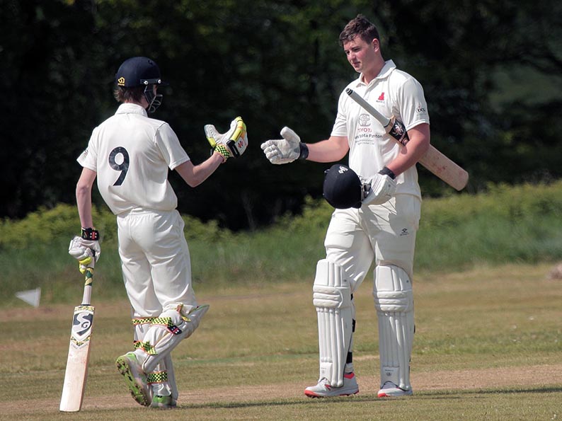 Noah Wright (right) is congratulated by Sam Woodcock on reaching his century against Plymouth CS&R<br>credit: All pictures on this page courtesy of Al Stewart