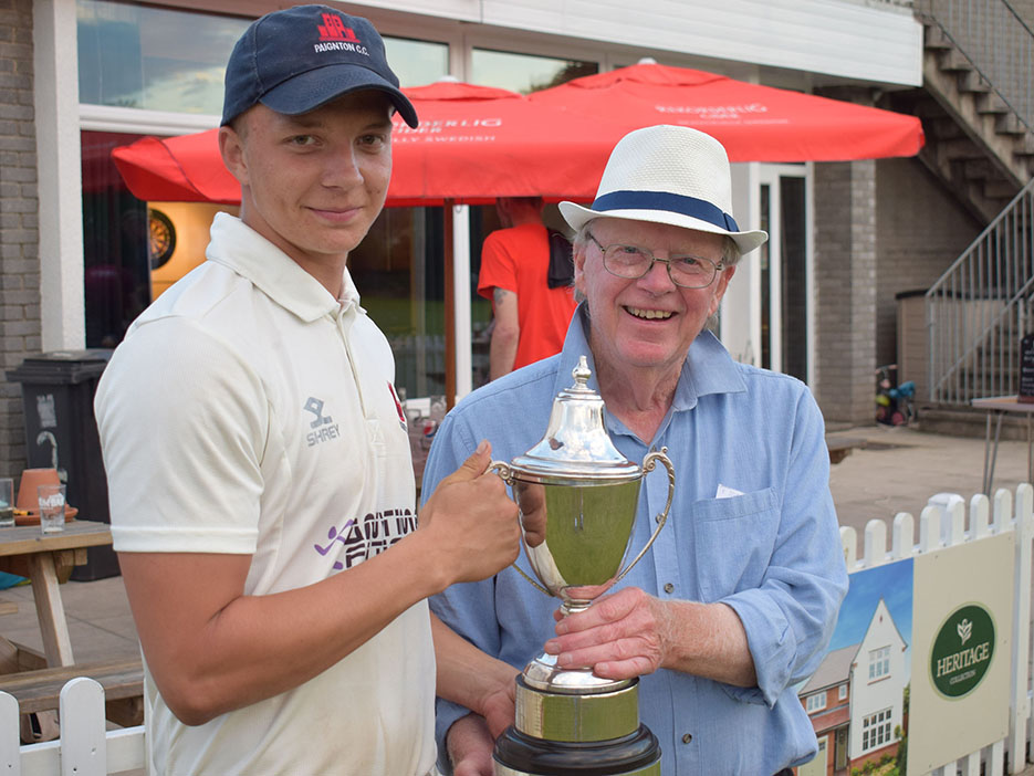 Paignton 2ndXI captain Harry Ward (left) receiving the Aaron Printers T20 Cup from cricket official John Webber after his side defeated Dartington & Totnes by 31 runs in Friday night’s final at South Devon CC <br>credit: Conrad Sutcliffe