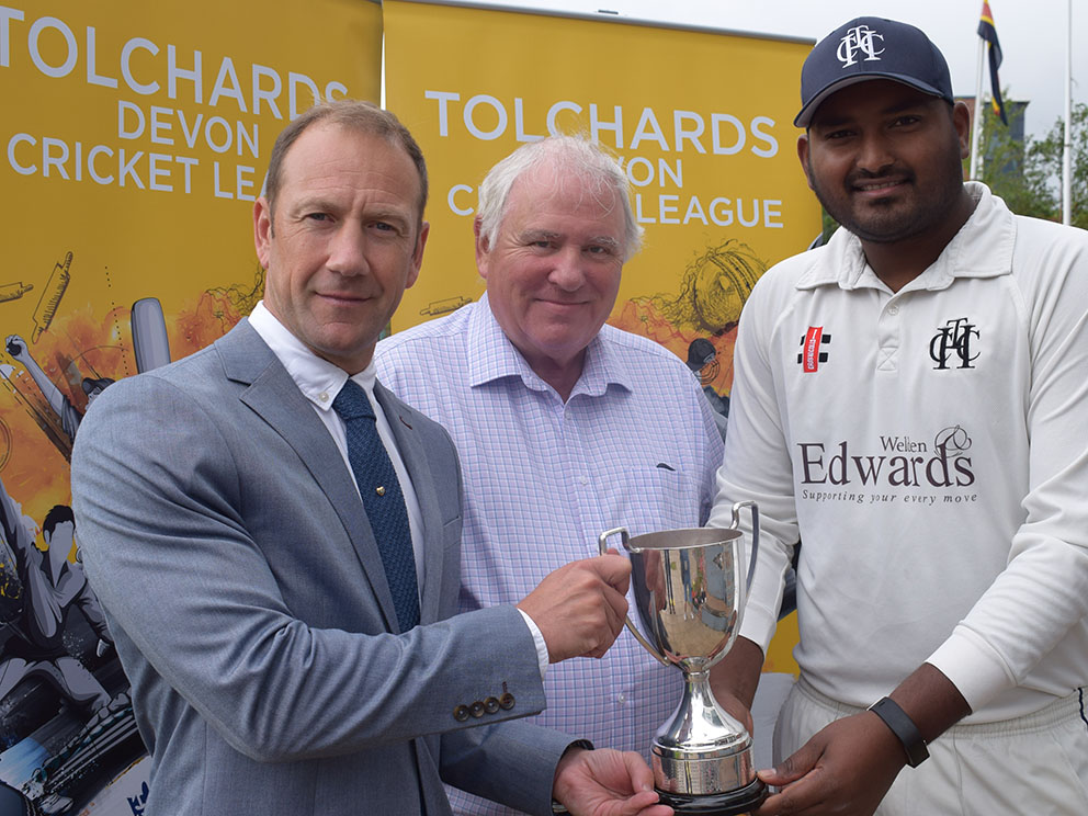 James Hunt from Tolchards Drinks presenting Heathcoat captain Jackson Thompson with the Premier Division cup. Pictured between them is Heathcoat chairman Rod Randerson<br>credit: Conrad Sutcliffe 