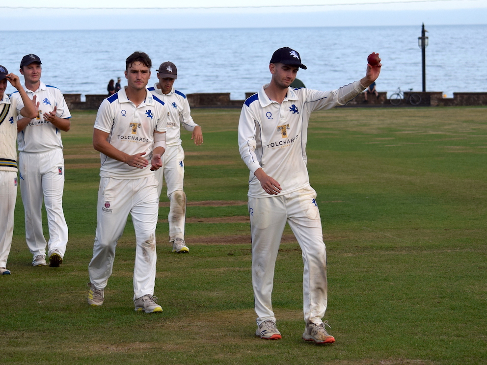 Devon's left-arm spinner Max Shepherd leads the team off the field after taking five for 32 in the game against Wiltshire at Sidmouth<br>credit: conrad Sutcliffe - no re-use without copyright owner's consent