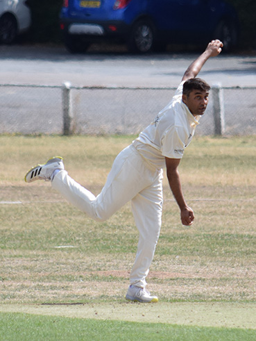 Aqeel Ahmed spinning away for Barton at Torquay,. He took three wickets but his team lost by 136 runs