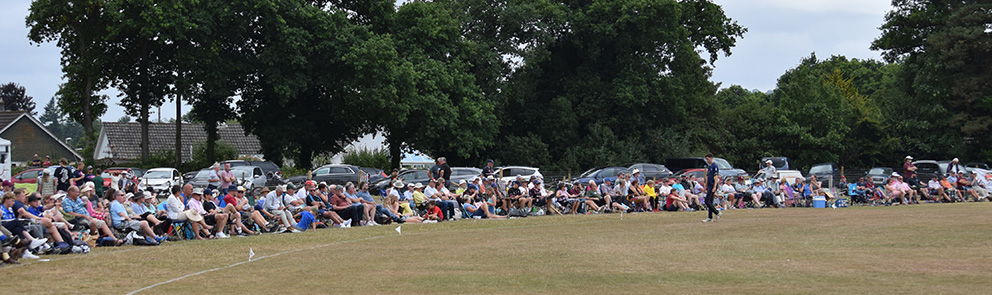 Every seat is taken on the boundary around the ground at Bovey Tracey
