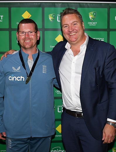 Dan Bowser (left) at the man-of-the-series presentation with a representative from the sponsors, Commonwealth Bank