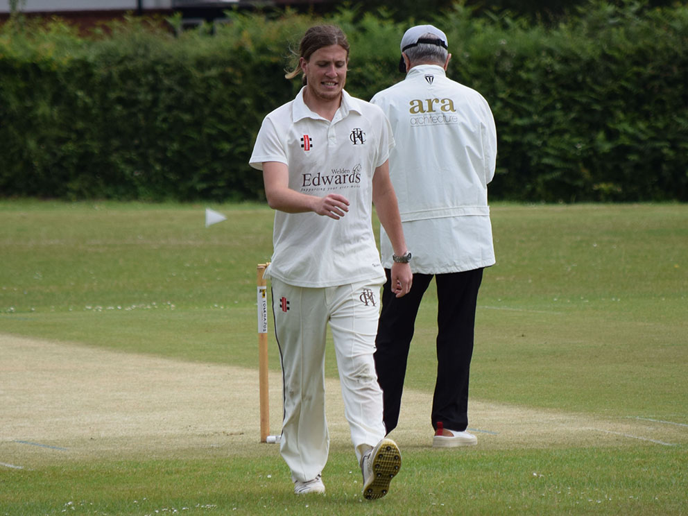 Heathcoat II's seamer Christian Cabburn strides back to his mark in the game at Bovey. He took four wickets, but Bovey won by 84 runs<br>credit: Conrad Sutcliffe - no re-use without copyright owner's consent
