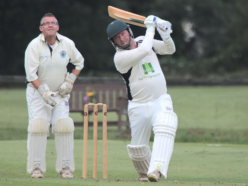 Ivybridge keeper Derek Solomon can only watch in admiration as PCS&R batter Rob Walker hits to ball down the ground<br>credit: Al Stewart 