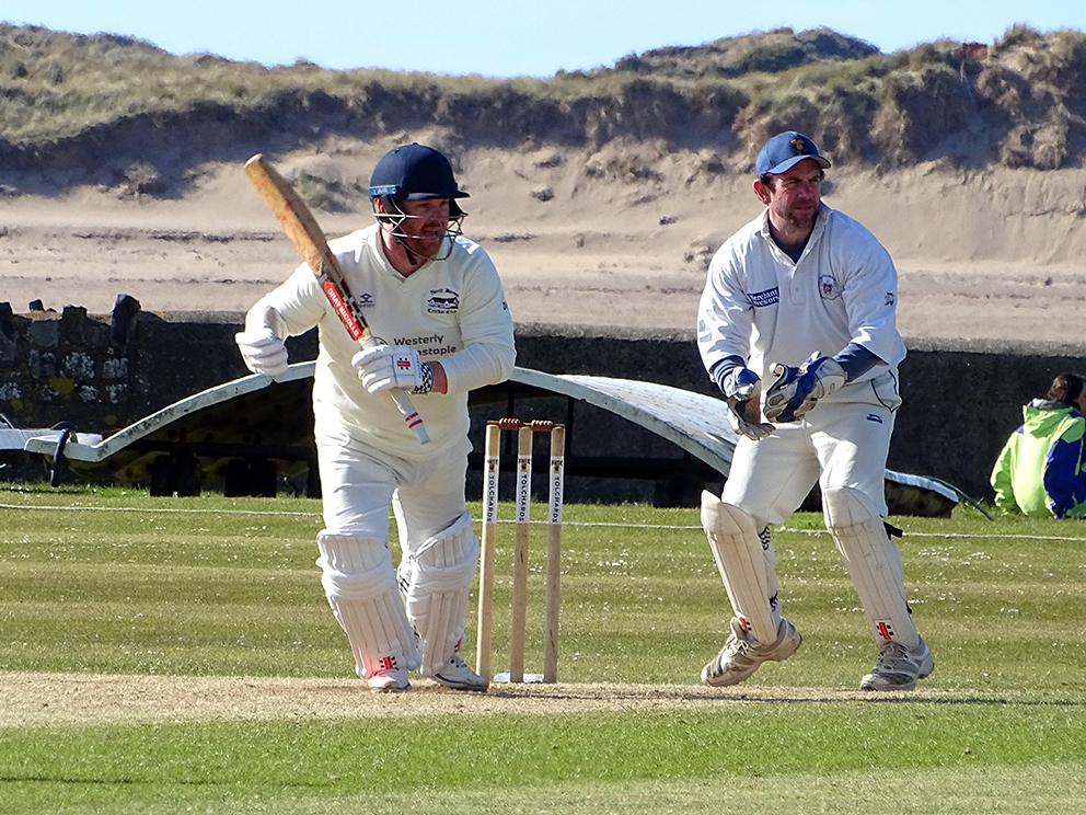 Dan Bowser rattling up the runs for North Devon against Braunton<br>credit: All pictures by Fiona Tyson