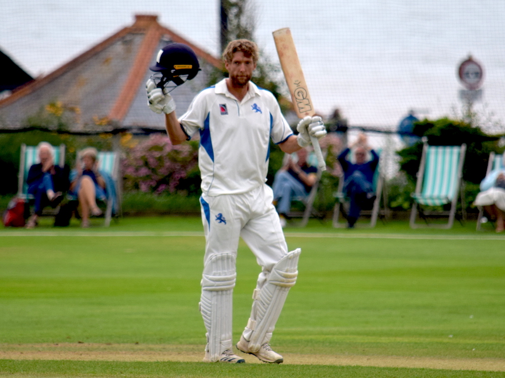 Devon's Calum Haggett raises his bat to acknowledge the applause of the crowd after reaching a hundred against Shropshire at Sidmouth<br>credit: Conrad Sutcliffe - no re-use without copyright owner's consent