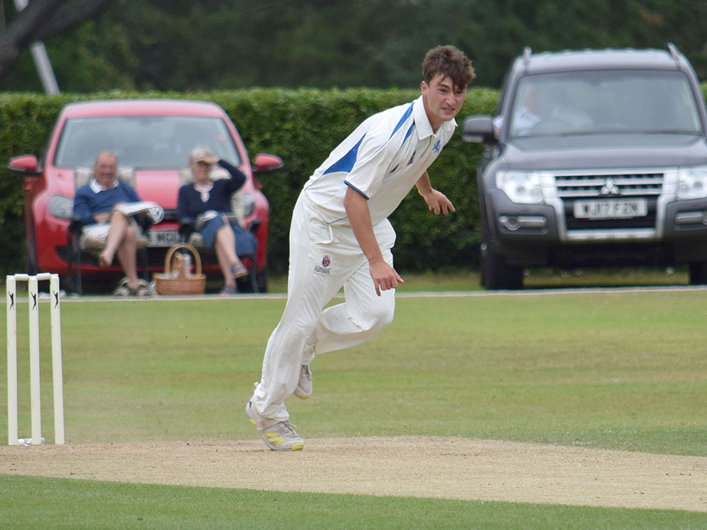 Kazi Szymanski on the way to a five-wicket haul for Devon against Cornwall<br>credit: Conrad Sutcliffe - no re-use without copyright owner's consent