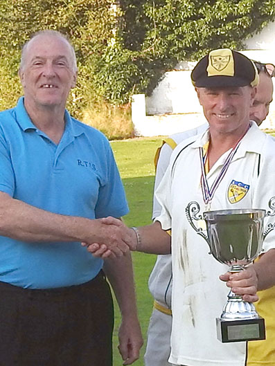 Richard Tidball (left) presenting the cup his company sponsors to Lustleigh’s winning captain Mike Wright.