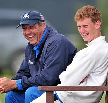 Keith Donohue (left) shares a joke with spinner Jamie Stephens during a break in play