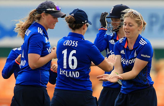 Heather Knight (right) celebrating the fall of a wicket