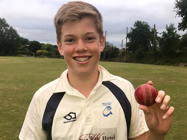 Max Mayor with the match ball he will keep as a souvenir after claiming six wickets for no runs in Ottery U14s’ win over Thoverton<br>credit: Mark Tyler