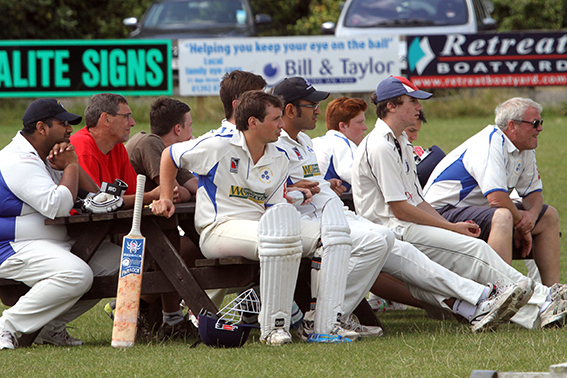 Players and spectators enjoying the cricket at Topsham