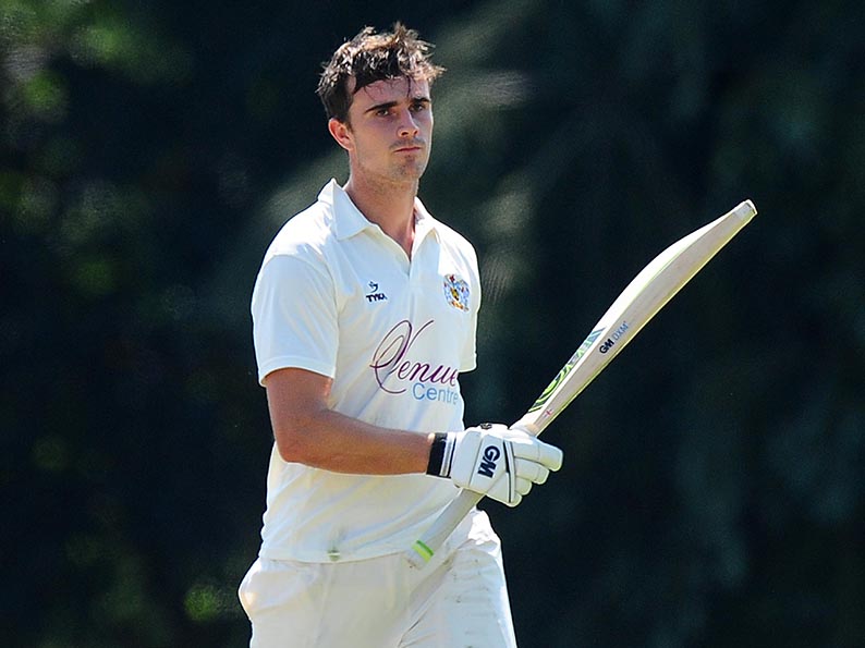 Exeter's Ben Green raises his bat after reaching a century against Hatherleigh on Saturday<br>credit: https://www.ppauk.com/photo/2001673/