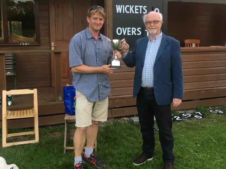 Ben Coe of Cheriton Fitzpaine collecting the League of Friends Cup from sponsor Andy Davis