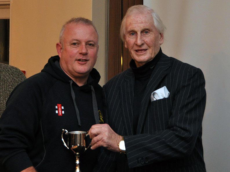 Paul Mitchell (Abbotskerswell) receiving a trophy from Stuart Munday