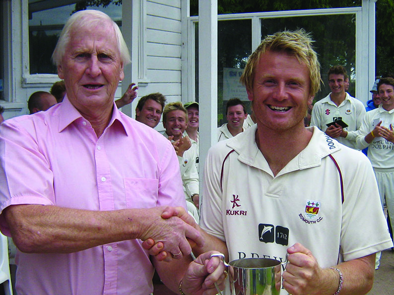 Stuart Munday (left) presenting the Devon Cup to Sidmouth's Will Murray
