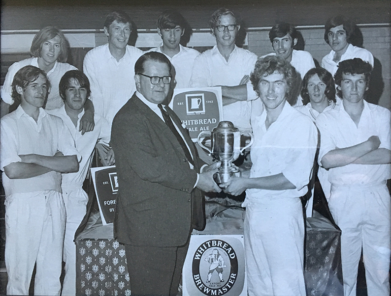 Bradninch captain John Freeman collecting the Whitbread Evening KO Cup after his side defeated Thorverton in the 1970 final at Exeter St Thomas CC. Terry Newall is pictured in second from the right in the back row. On the end of the line is Derrick Foan