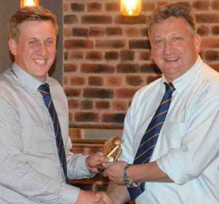 Ashsley Harvey (left) receiving the 1st XI player of the year trophy from Matt Quartley