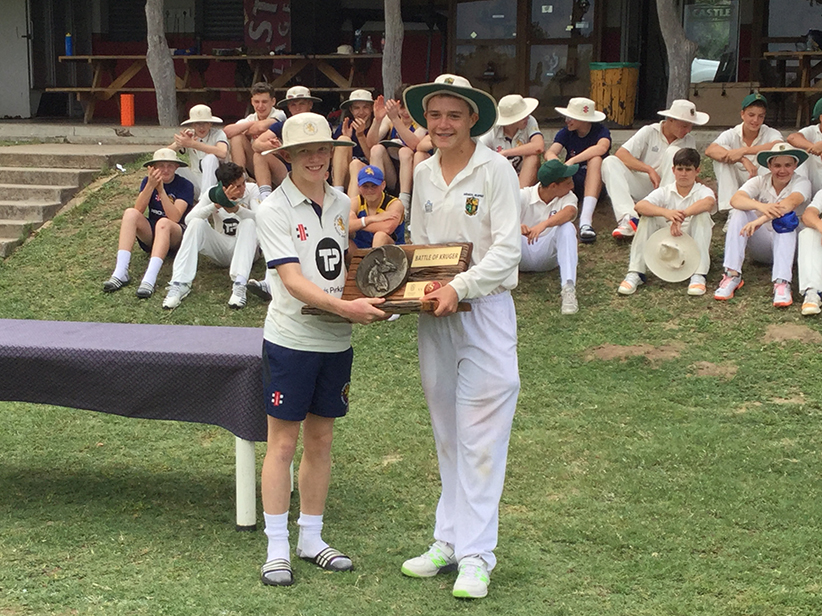 Jasper Presswell receiving the Battle of Kruger Trophy from his opposite number