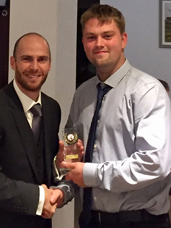 Ashburton 1st XI captain Ashley Berry presents Tom Durman (right) with the club's bowler of the year award