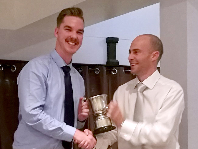 Tristan Wakefield receiving Ashburton's all-rounder cup from 1st XI captain Ashley Berry