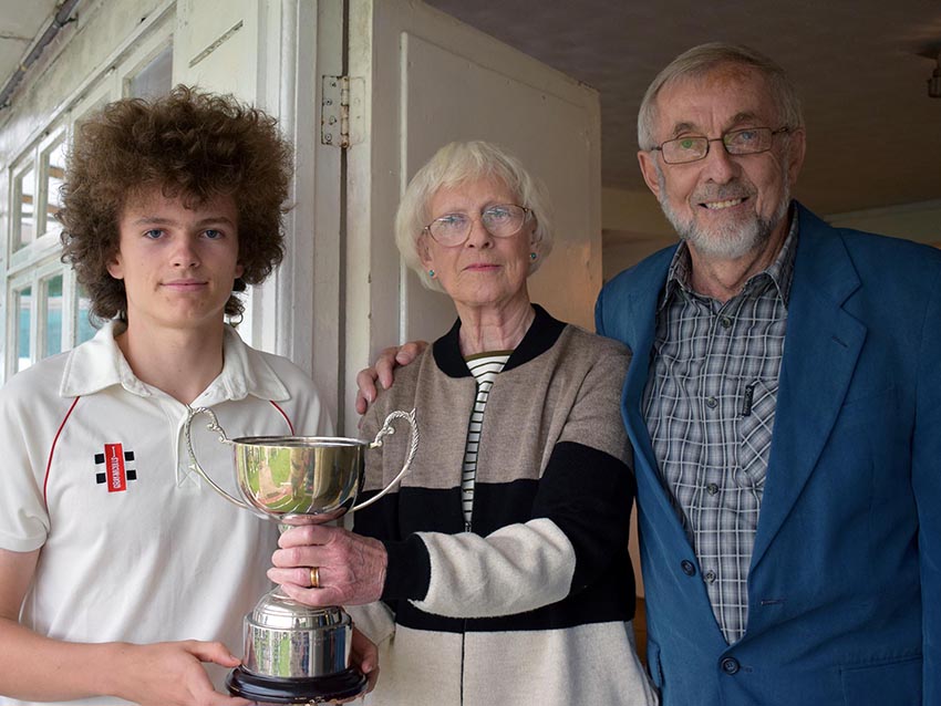 Man of the match Luke Medlock with his trophy and Angela Glendenning and Frank Heal, who made the award