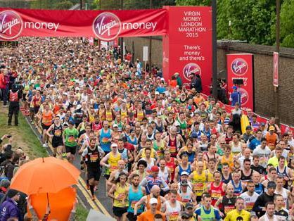 Runners stream away from the start of the London Marathon