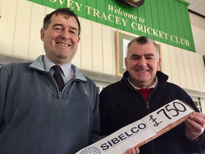 Keith Lee (left) handing over the grant to Bovey Tracey chairman Nigel Mountford