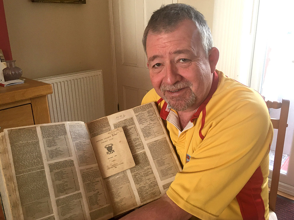 Conrad Sutcliffe about to dive into the 140-year-old scrapbook for a trip into the past<br>credit: P K Bennett