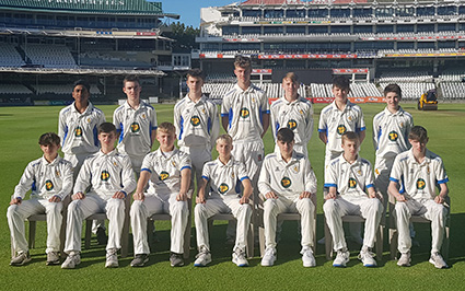 The Devon Development squad pose on the outfield at Newlands for a squad picture during the second-leg of their tour to South Africa. Back (left to right): Jacob Kopparambil, Jake Pascoe, Alec Holifield, Will Warren, Noah Rider, Eddie Butler, Noah Carlisle; front: Teddy Haffenden, Zach Dunn, Lawrence Walker, Jack Whittaker, Harry Passenger, Matt Jeacock, James Tyler