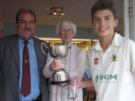 Man of the match Elliott Adams collecting the cup from Tim Chapman and Angela Glendenning