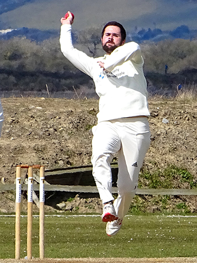 Fred King reaches the crease bowling for North Devon against Braunton