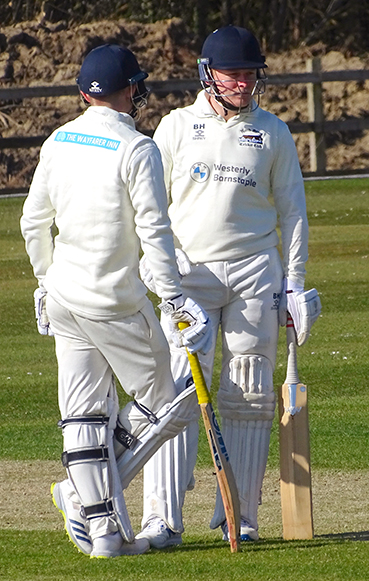 North Devon batters Jack Moore and Ben Howe talk tactics between overs | Photo: Fiona Tyson