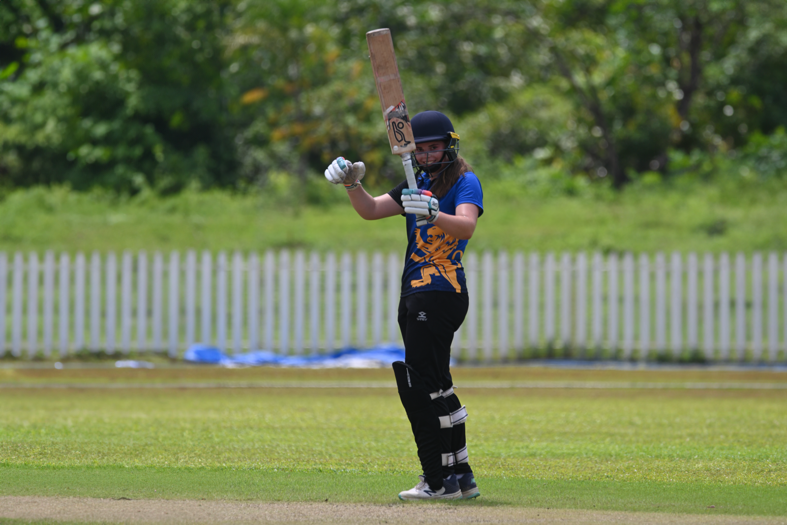Ella Gill celebrates reaching 50 runs against  Sri Medhankara National School.
