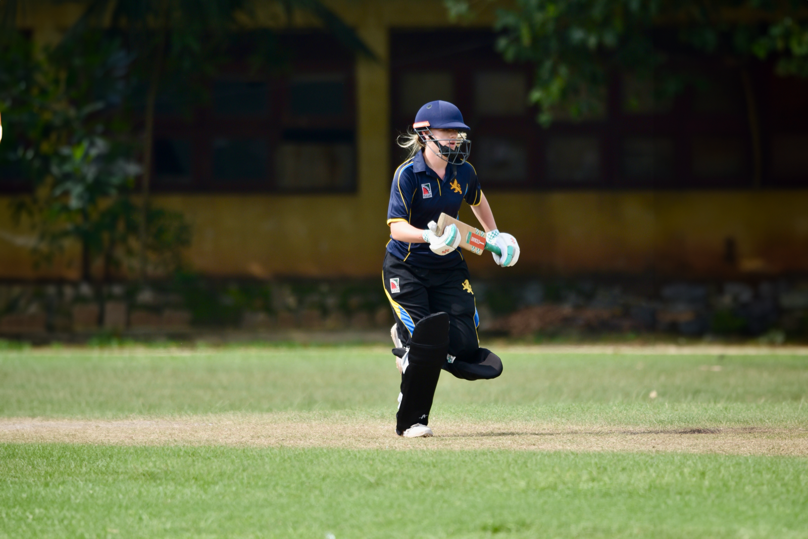 Holly Evans completes a run in the game against Mercantile Cricket Association Girls.