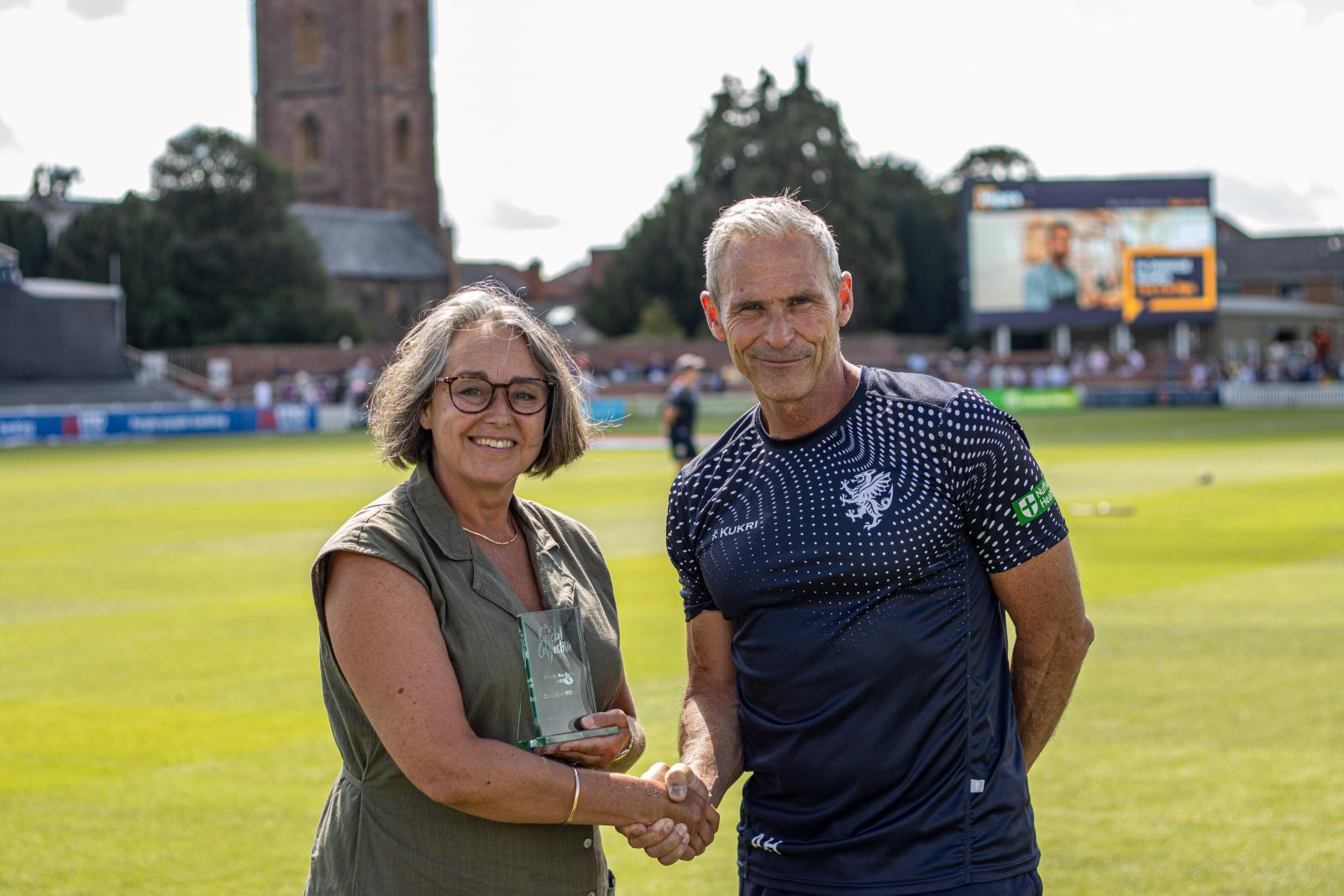 Caroline Wilson receives her award at the Cooper Associates County Ground.
