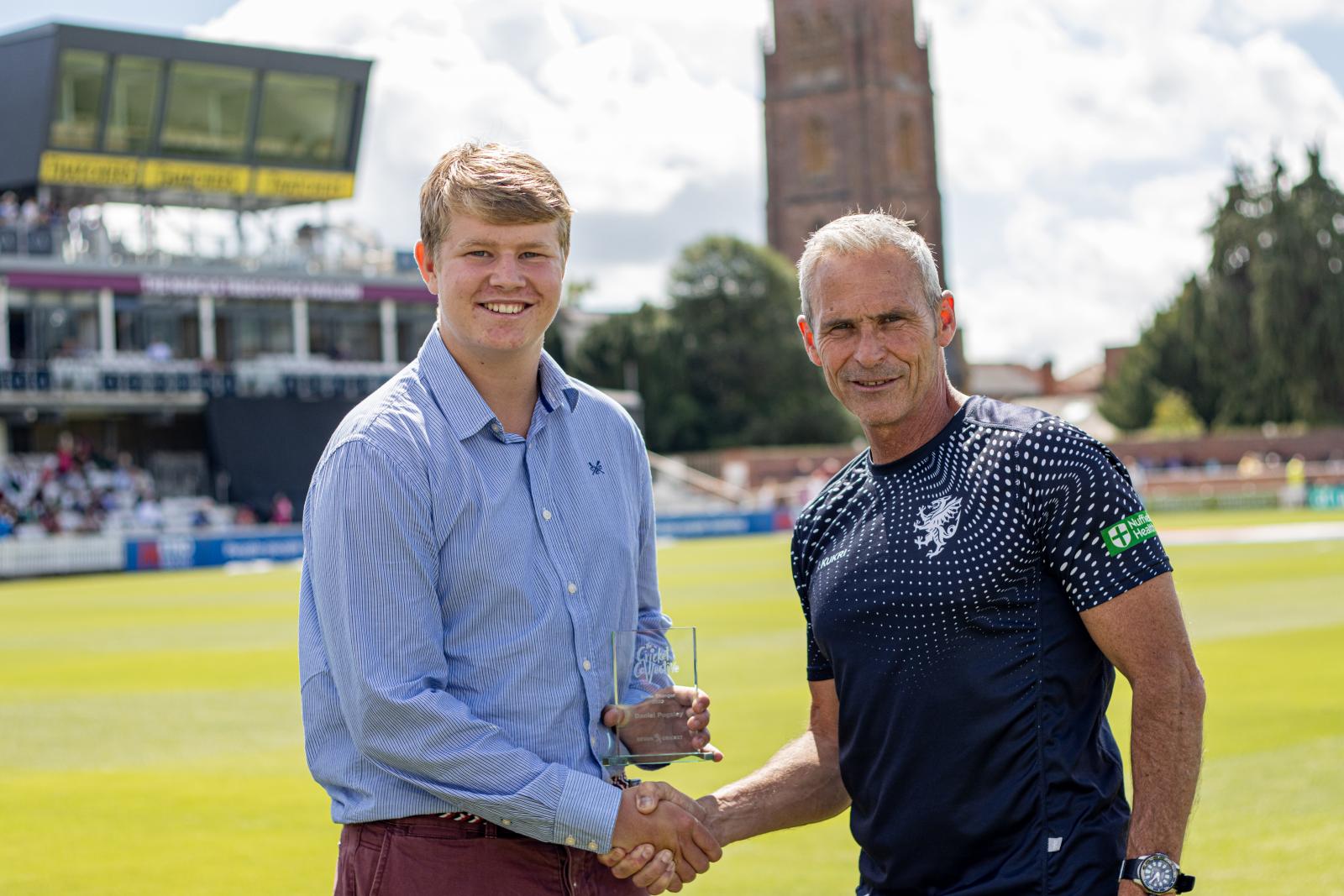 Daniel Pugsley receives his award at the Cooper Associates County Ground.