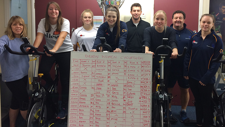 Pedalling away on static bikes at Plymouth College are (left to right): Debbie Halliday, Milly Squire, Becca Halliday, Claire Varcoe, Alex Carr, Becca Silk, Warren Carr, Charlotte Phillips. 