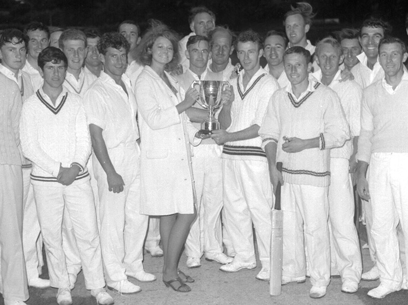 Flashback! Abbotskerswell captain Robin Pugh receives the old Narracott Cup from Roxanne Narracott after his side defeated Barton in the 1966 final. Members of both teams are in the photo