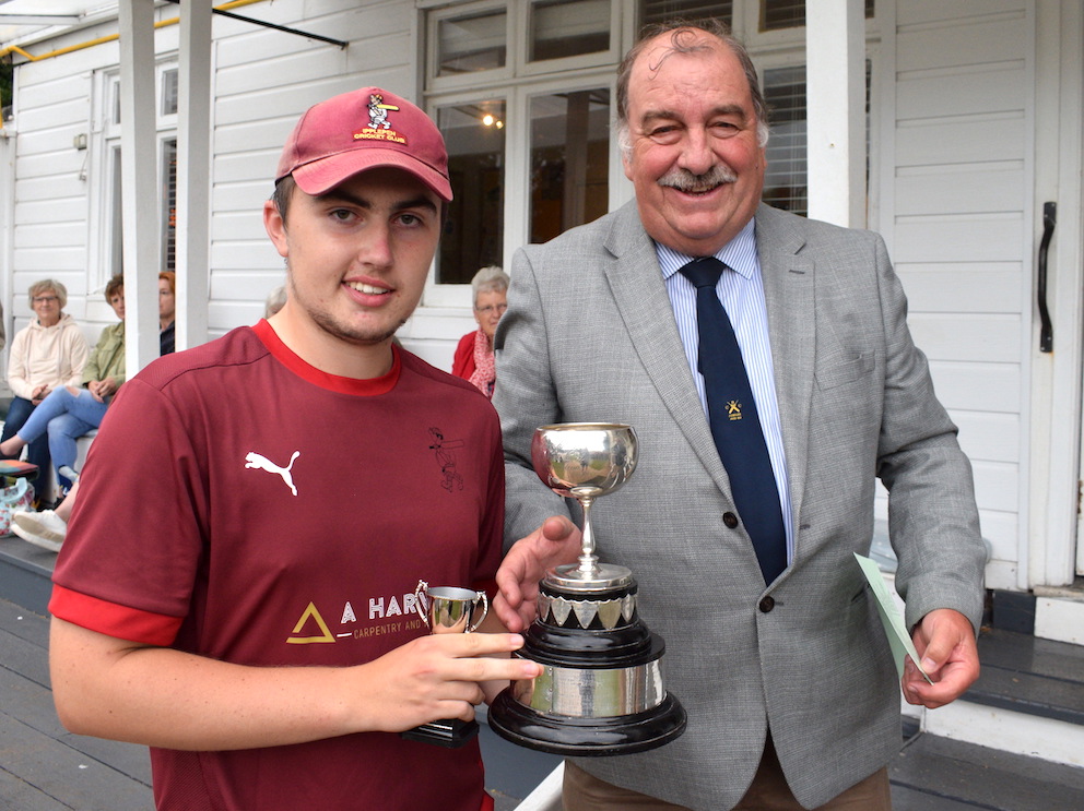 Ipplepen's George Tapley collects the Brockman Cup from competition chairman Tim Chapman<br>credit: Conrad Sutcliffe - no re-use without copyright owner's consent