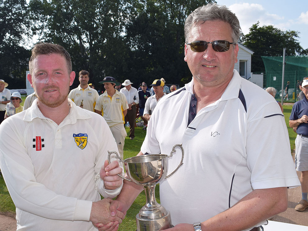 Lustleigh's James Fulner collecting the man of the match award from Matt Quartley of sponsors Valeport after last summer's Brockman Cup final<br>credit: Conradcopy Ltd